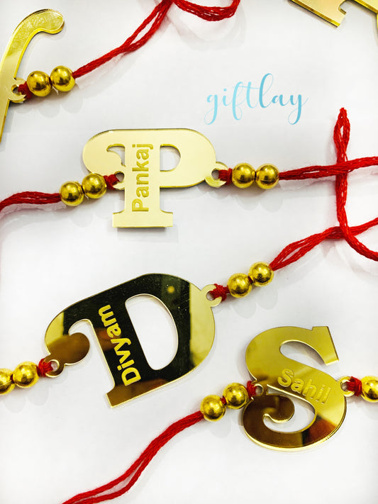 Golden Mirror Acrylic Initials Name Rakhi - Customised Rakhis